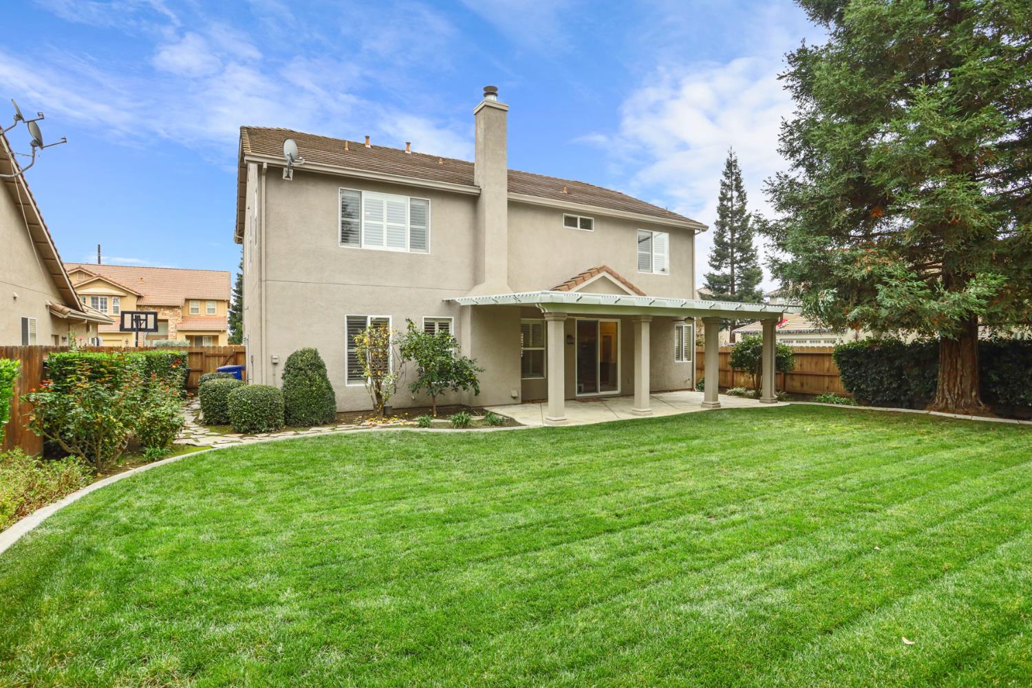 4305 Lourmarin Lane Modesto, CA 95356 - Photo 52 of 58 a front view of a house with a garden