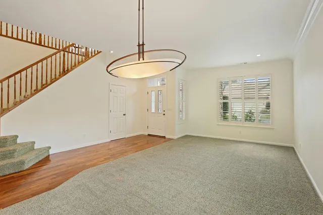 a view of an empty room with windows