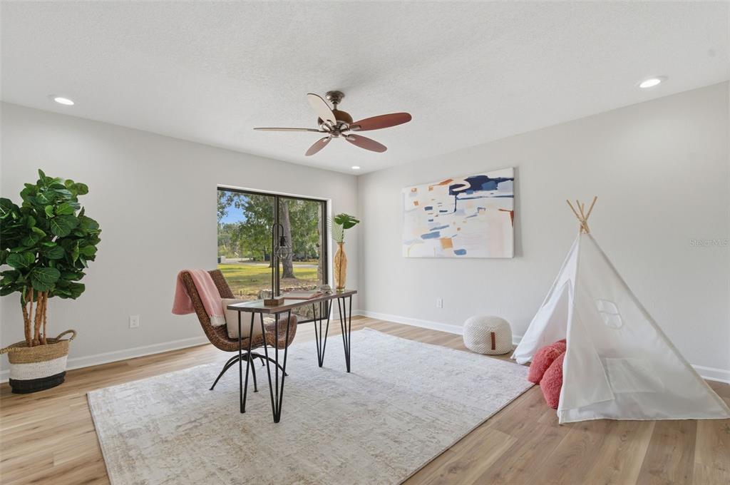 916 River Rapids Avenue Brandon, FL 33511 - Photo 14 of 61 a workspace with furniture window and wooden floor