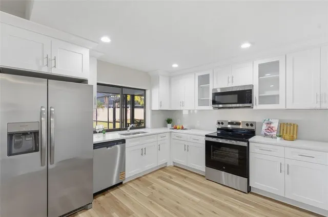 a living room with fireplace furniture and a wooden floor