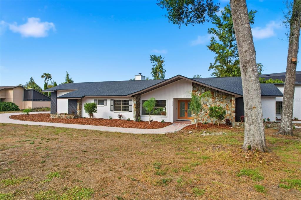916 River Rapids Avenue Brandon, FL 33511 - Photo 2 of 61 a front view of a house with a yard and porch