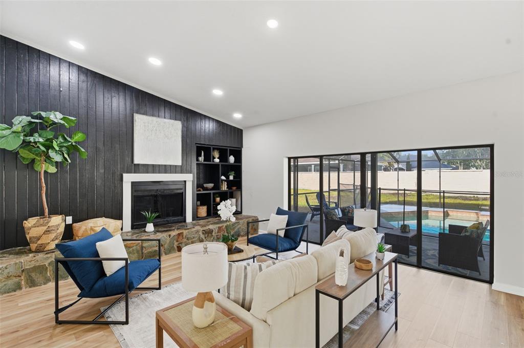 916 River Rapids Avenue Brandon, FL 33511 - Photo 22 of 61 a living room with furniture fireplace and a large window