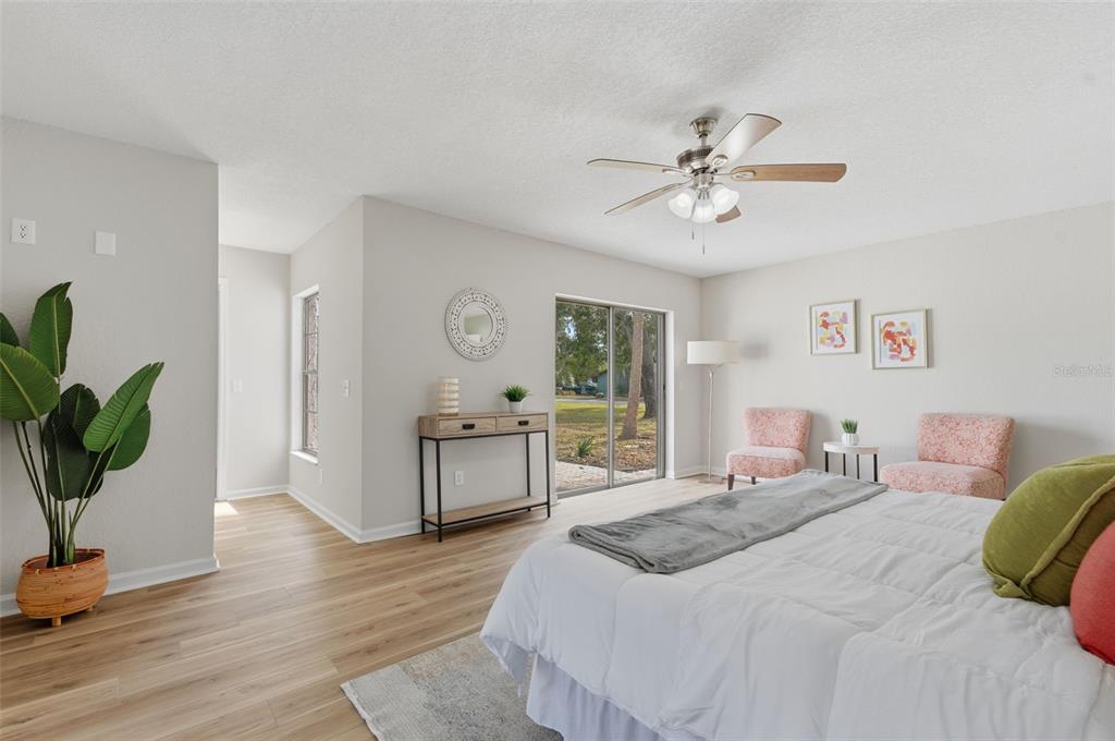 916 River Rapids Avenue Brandon, FL 33511 - Photo 30 of 61 a bedroom with a bed chandelier and a window