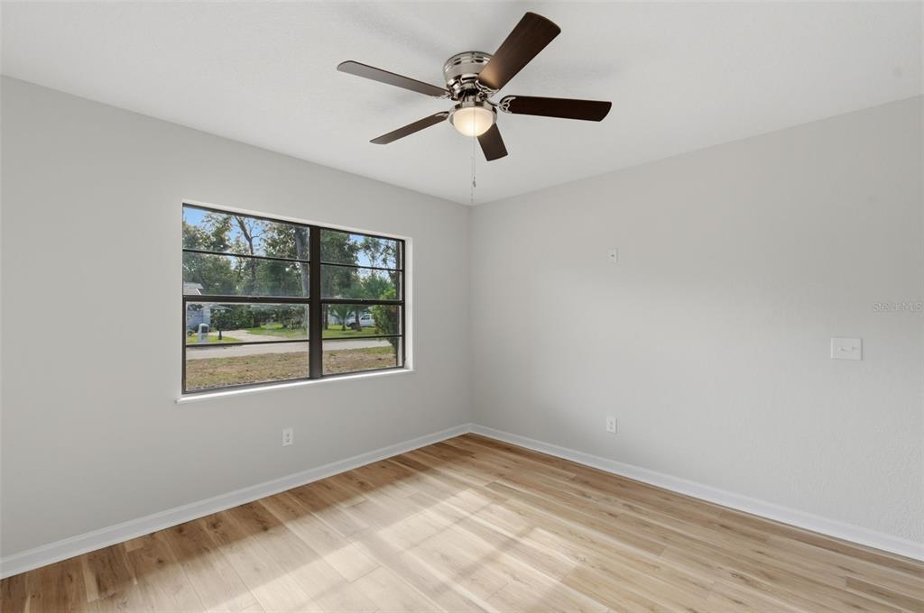 916 River Rapids Avenue Brandon, FL 33511 - Photo 38 of 61 a view of empty room with wooden floor and fan