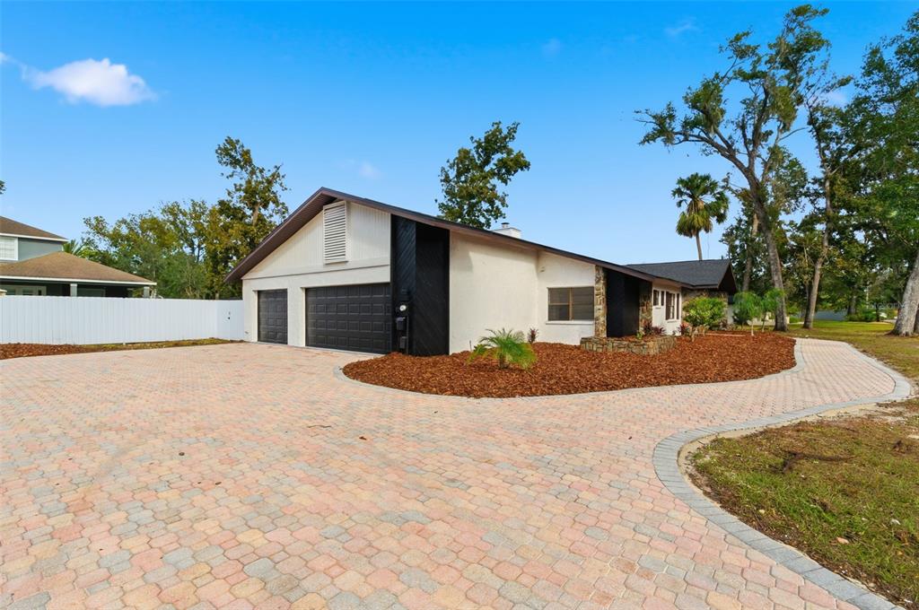 916 River Rapids Avenue Brandon, FL 33511 - Photo 4 of 61 a view of a house with a yard and garage