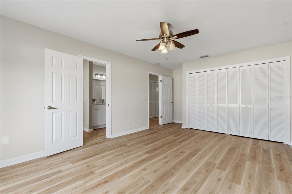916 River Rapids Avenue Brandon, FL 33511 - Photo 45 of 61 a view of empty room with wooden floor and ceiling fan