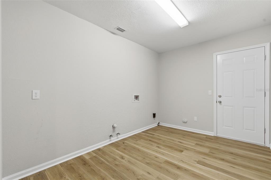 916 River Rapids Avenue Brandon, FL 33511 - Photo 49 of 61 a view of empty room with wooden floor