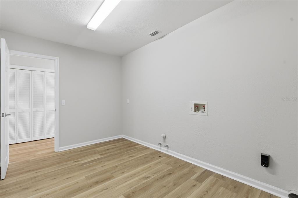 916 River Rapids Avenue Brandon, FL 33511 - Photo 50 of 61 a view of a room with wooden floor