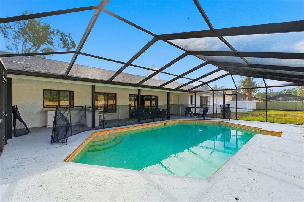 916 River Rapids Avenue Brandon, FL 33511 - Photo 56 of 61 a view of a swimming pool with a patio