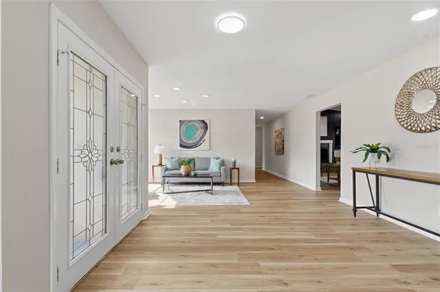 a living room with furniture and a large window