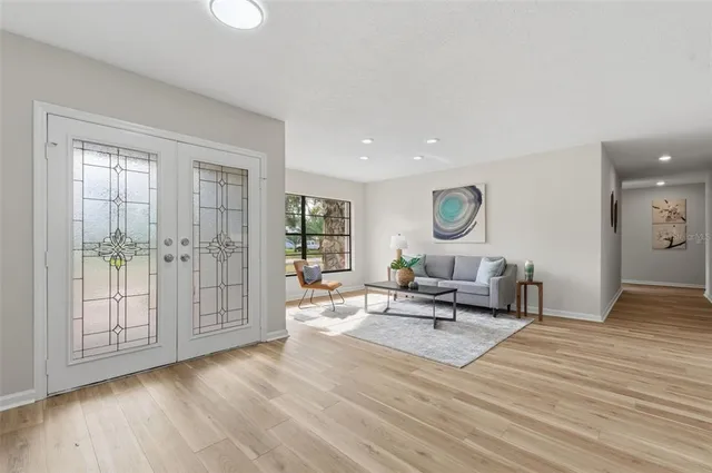 a living room with furniture and a large window