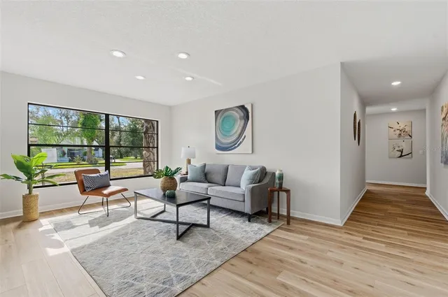 a living room with furniture and a window