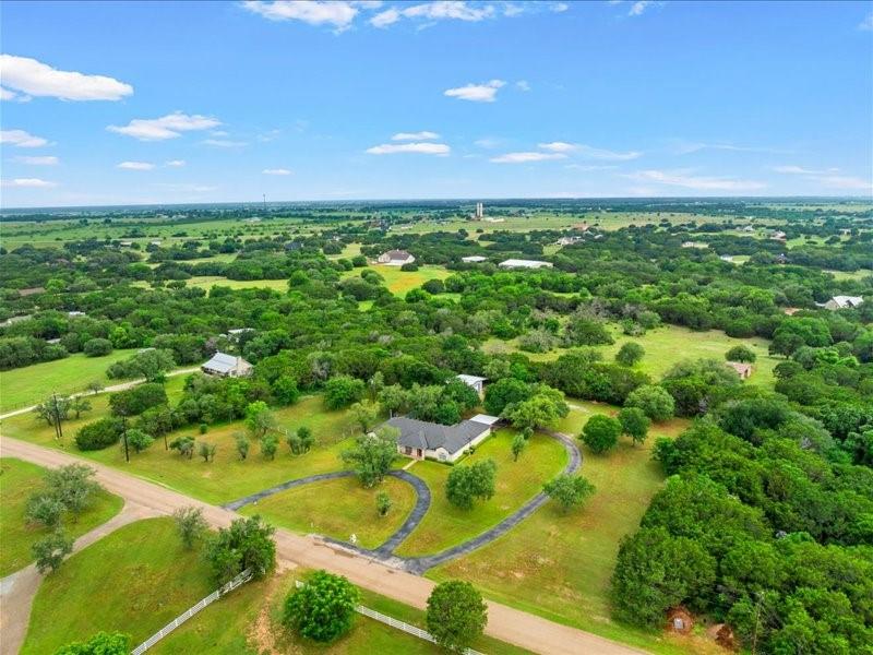 1072 Chapman Road Crawford, TX 76638 - Photo 36 of 39 a view of a yard with plants and large trees