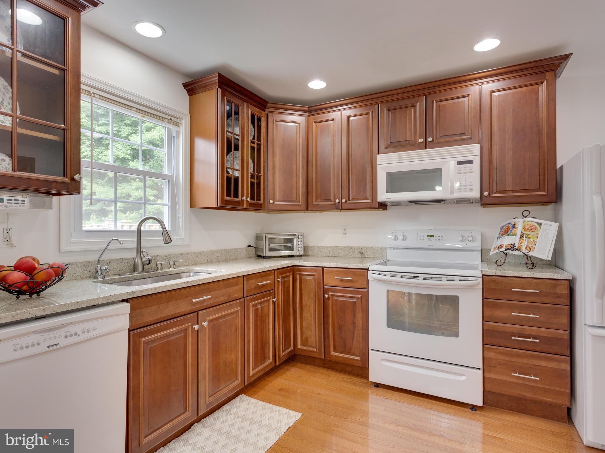 7770 Brandeis Way Springfield, VA 22153 - Photo 10 of 30 Kitchen with Beautiful Maple Cabinetry and Granite