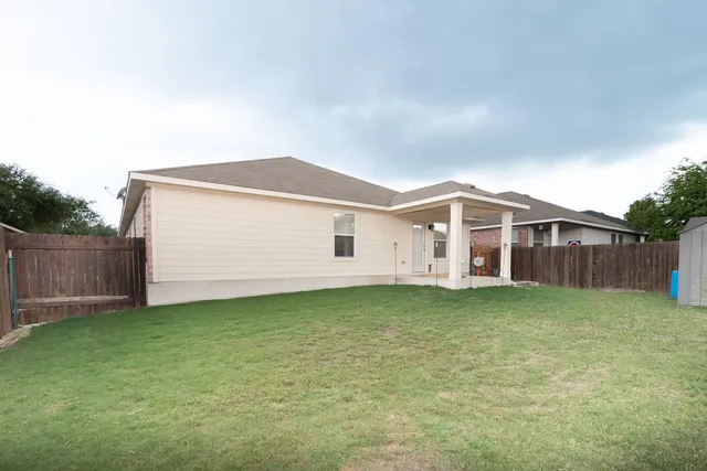 a view of a backyard of house