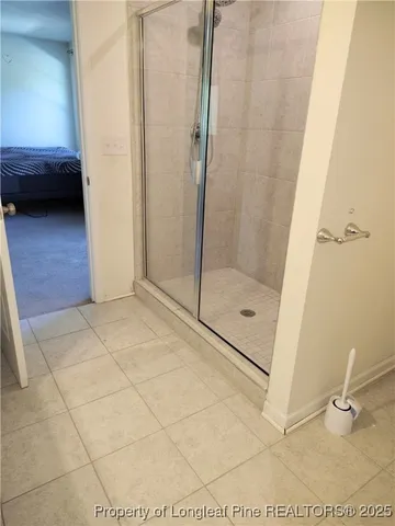 a bathroom with a tub and a shower