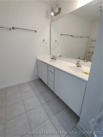 a bathroom with a sink and mirror