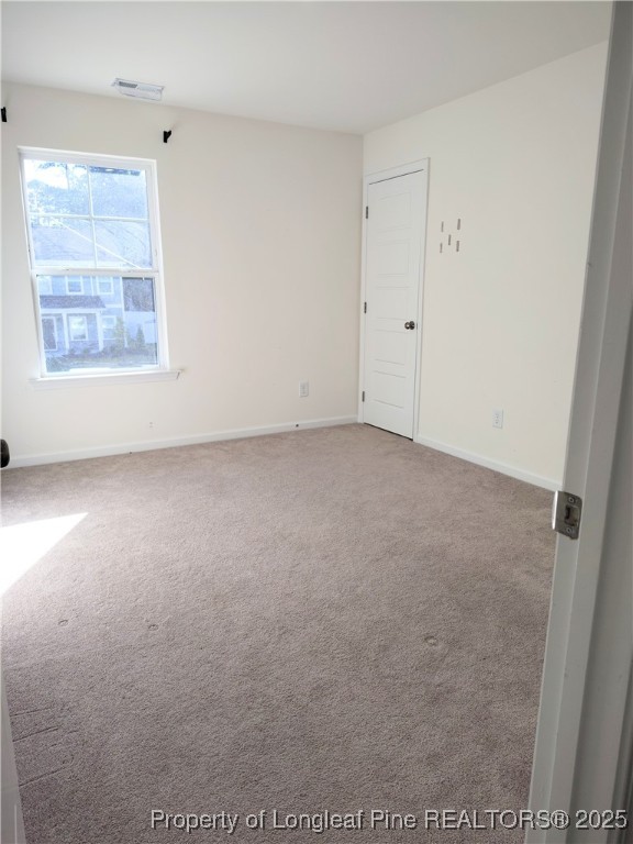 114 Sutherland Road Sanford, NC 27330 - Photo 9 of 16 an empty room with windows