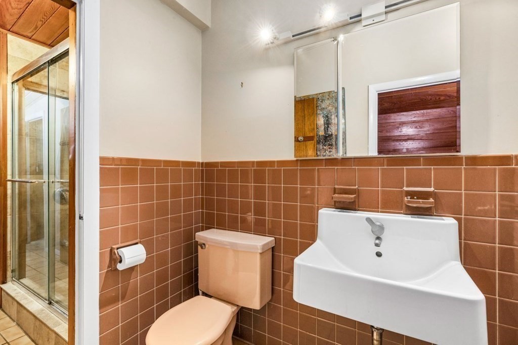 175 Bay Road Sharon, MA 02067 - Photo 16 of 19 a bathroom with a toilet a sink and mirror