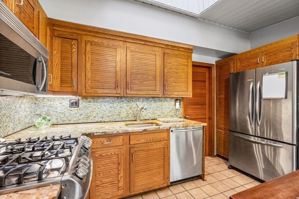 175 Bay Road Sharon, MA 02067 - Photo 10 of 19 a kitchen with stainless steel appliances granite countertop a refrigerator sink and stove