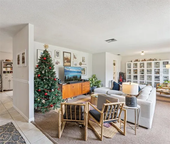a dining room with furniture window and wooden floor