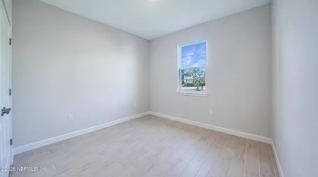 an empty room with windows