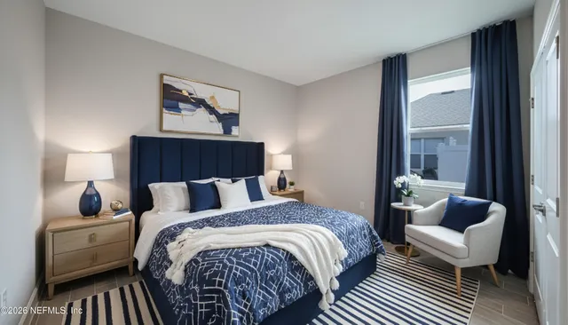 a bedroom with a bed and a couch