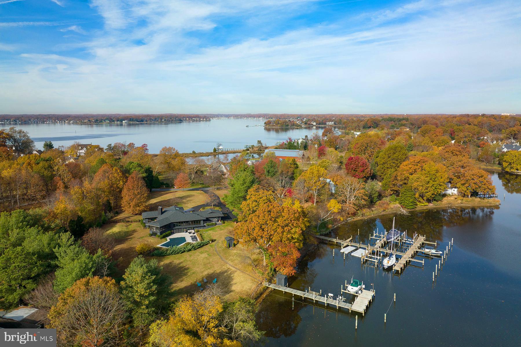 Beautiful 1.6 acre setting with deep-water pier