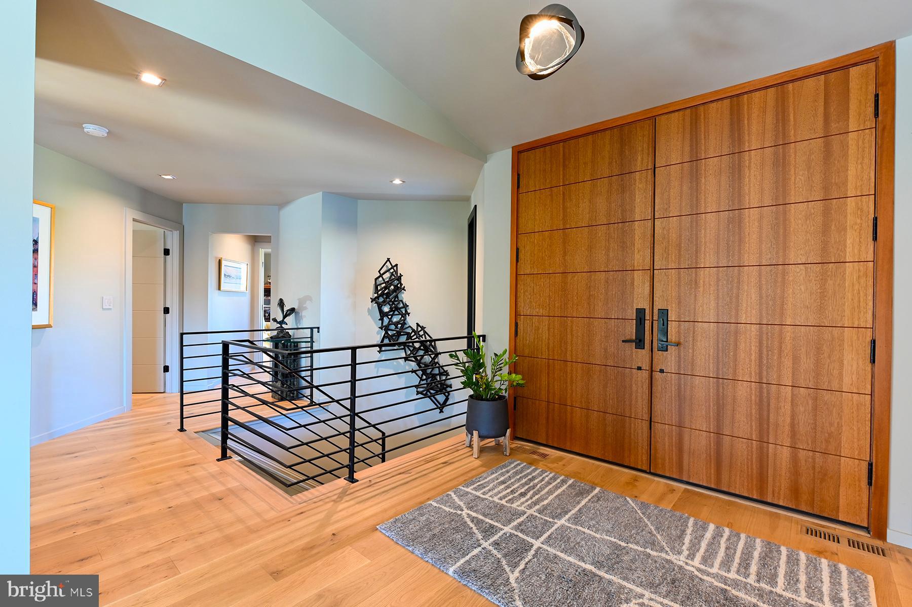 3333 Harness Creek Road Annapolis, MD 21403 - Photo 40 of 75 The nautical feeling railing leads to lower level