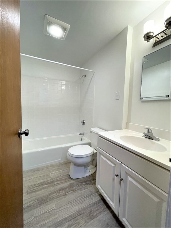 4 Dodge Road, Unit 1A10 Rowley, MA 01969 - Photo 5 of 5 a bathroom with a sink a toilet and shower