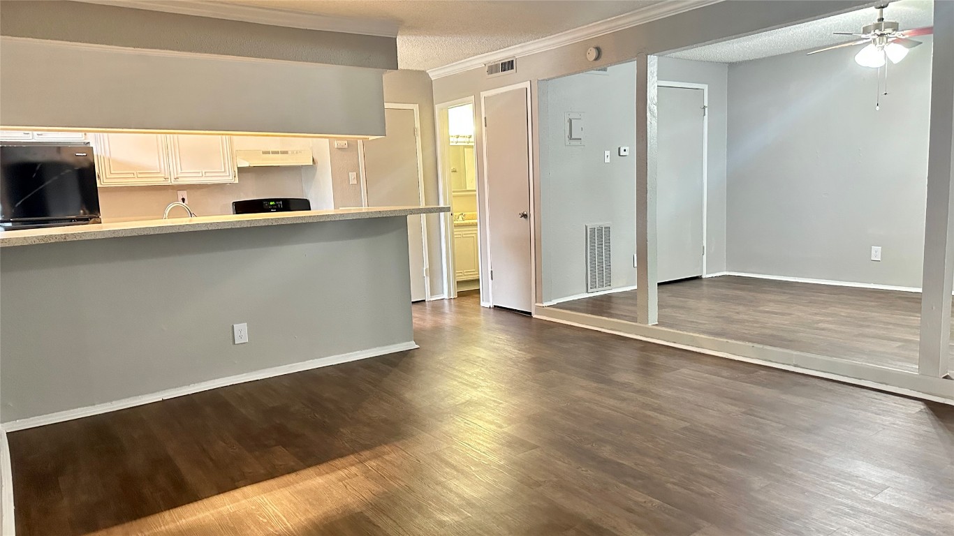 5426 Menchaca Road, Unit 211 Austin, TX 78745 - Photo 2 of 5 a view of a kitchen with a sink and a large window