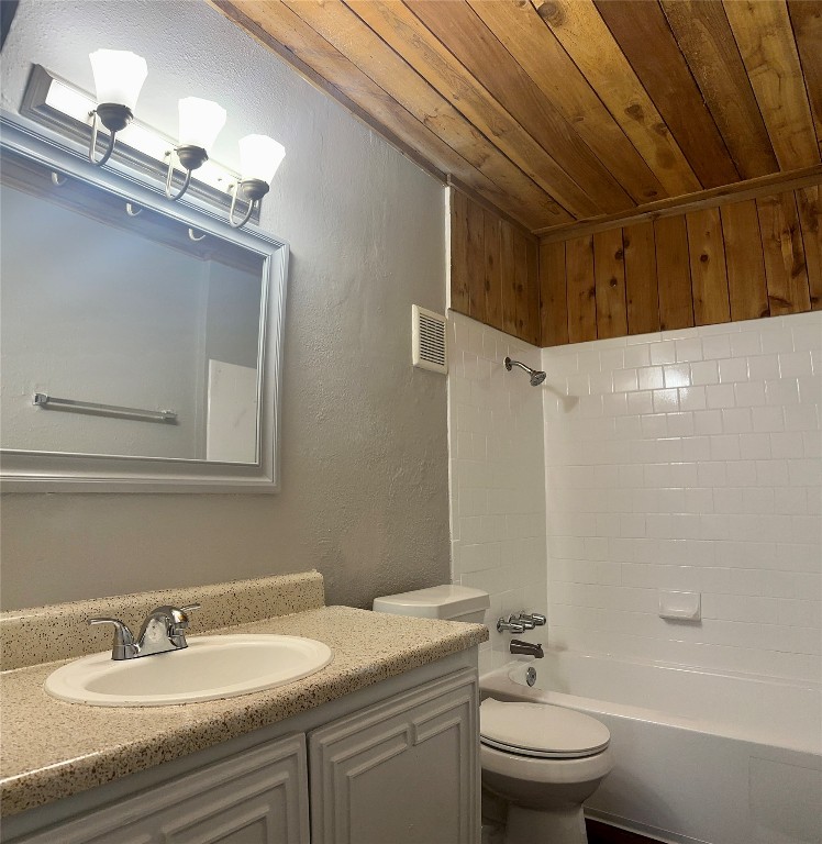 5426 Menchaca Road, Unit 211 Austin, TX 78745 - Photo 4 of 5 a bathroom with a sink a toilet and shower