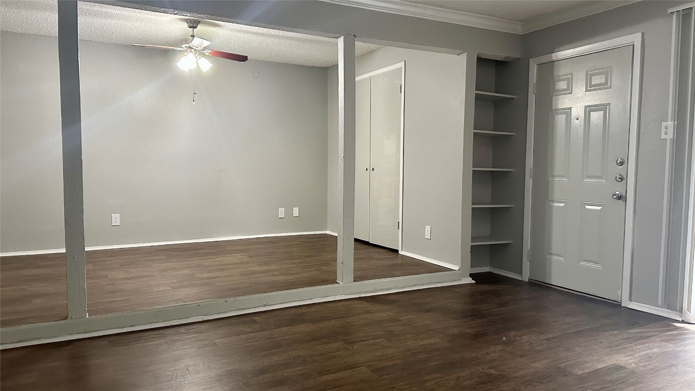 5426 Menchaca Road, Unit 211 Austin, TX 78745 - Photo 5 of 5 an empty space with wooden floor