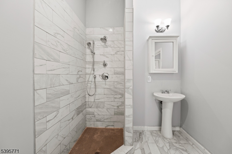 176 Union Avenue Rutherford, NJ 07070 - Photo 8 of 13 a bathroom with a sink a toilet and shower