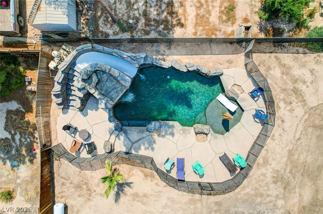 3765 Berkeley Street Logandale, NV 89021 - Photo 84 of 87 An inviting private pool featuring a rock-sculpted waterslide.