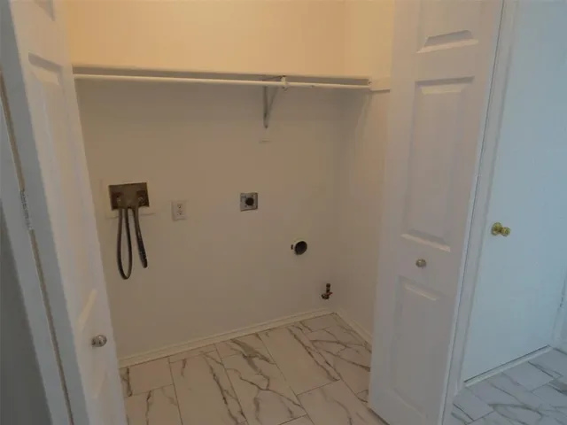a bathroom with a tub shower and a sink