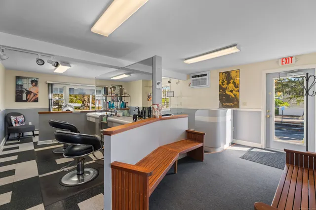 a room with furniture a flat screen tv and a window