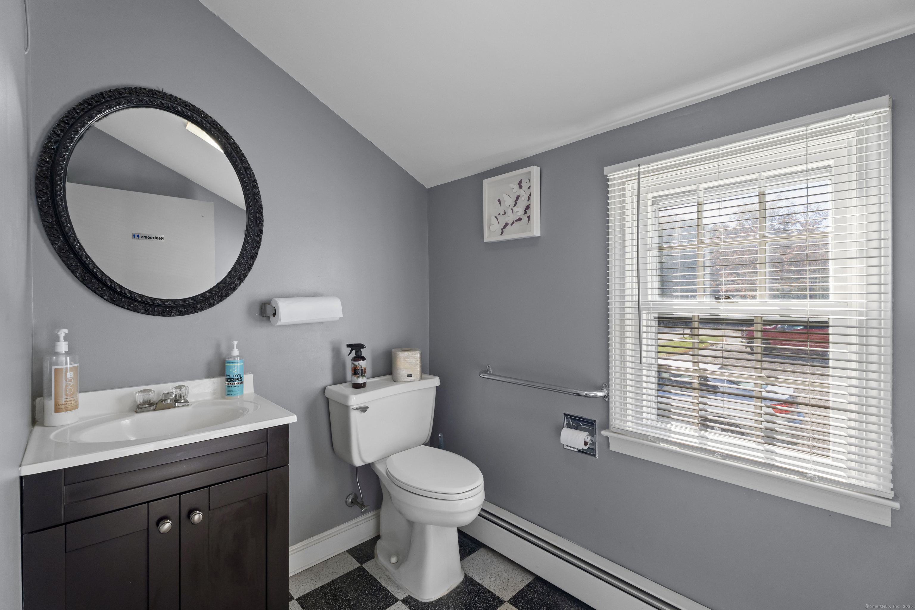 56 Norwich Avenue Colchester, CT 06415 - Photo 21 of 40 a bathroom with a toilet a sink and mirror