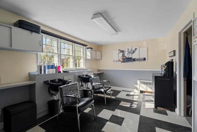 a room with furniture a rug and a window