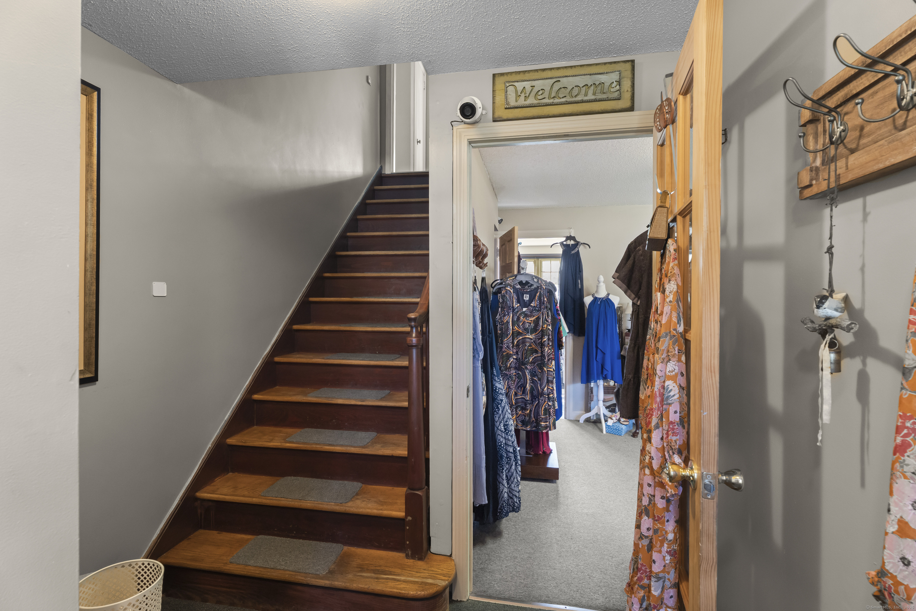 56 Norwich Avenue Colchester, CT 06415 - Photo 24 of 40 a view of hallway with stairs and wooden floor