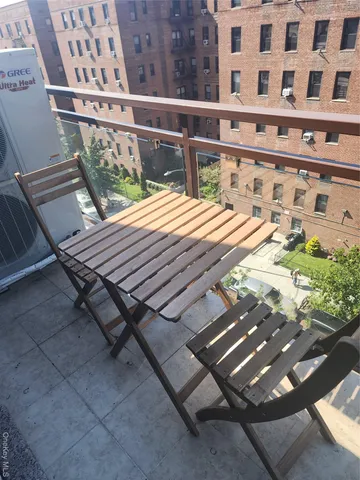 a view of balcony with wooden floor