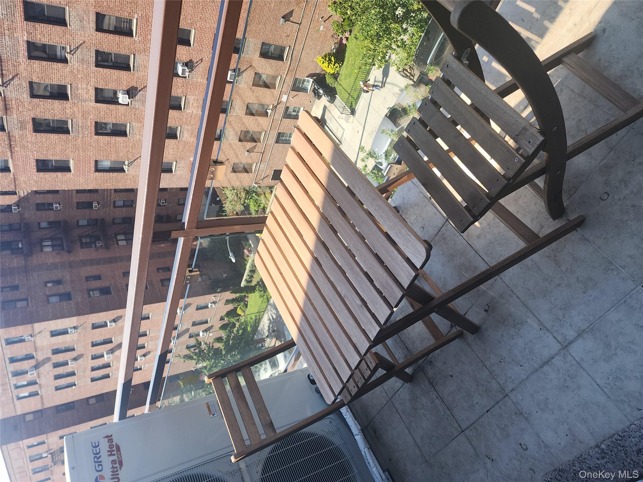 97-30 64th Avenue, Unit 4A Queens, NY 11374 - Photo 6 of 6 a view of balcony with wooden floor