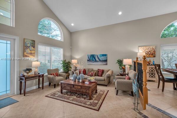 17794 Southwest 47th Street Miramar, FL 33029 - Photo 11 of 39 a living room with furniture a dining table and a window