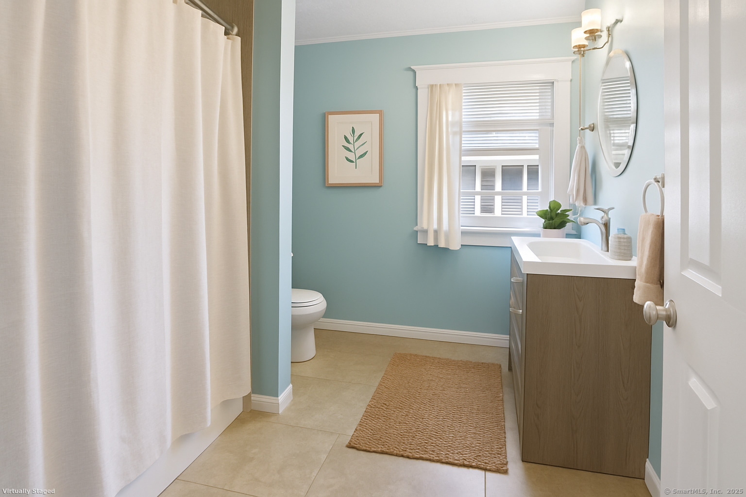 a bathroom with a sink a toilet and a window