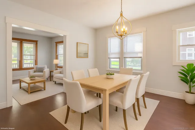 a view of a dining room with furniture window and wooden floor