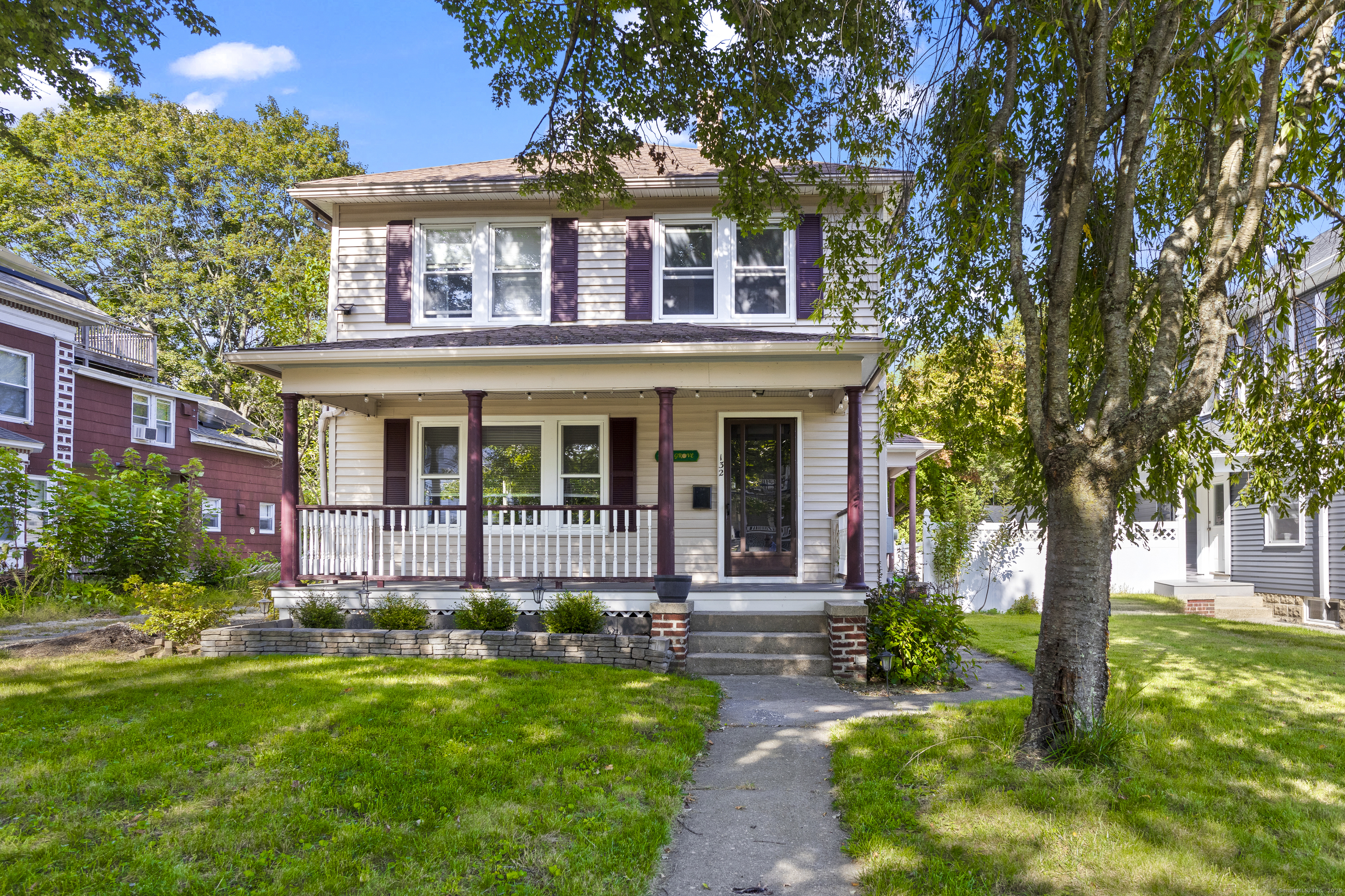 132 Grove Street Putnam, CT 06260 - Photo 2 of 36 a front view of a house with a yard