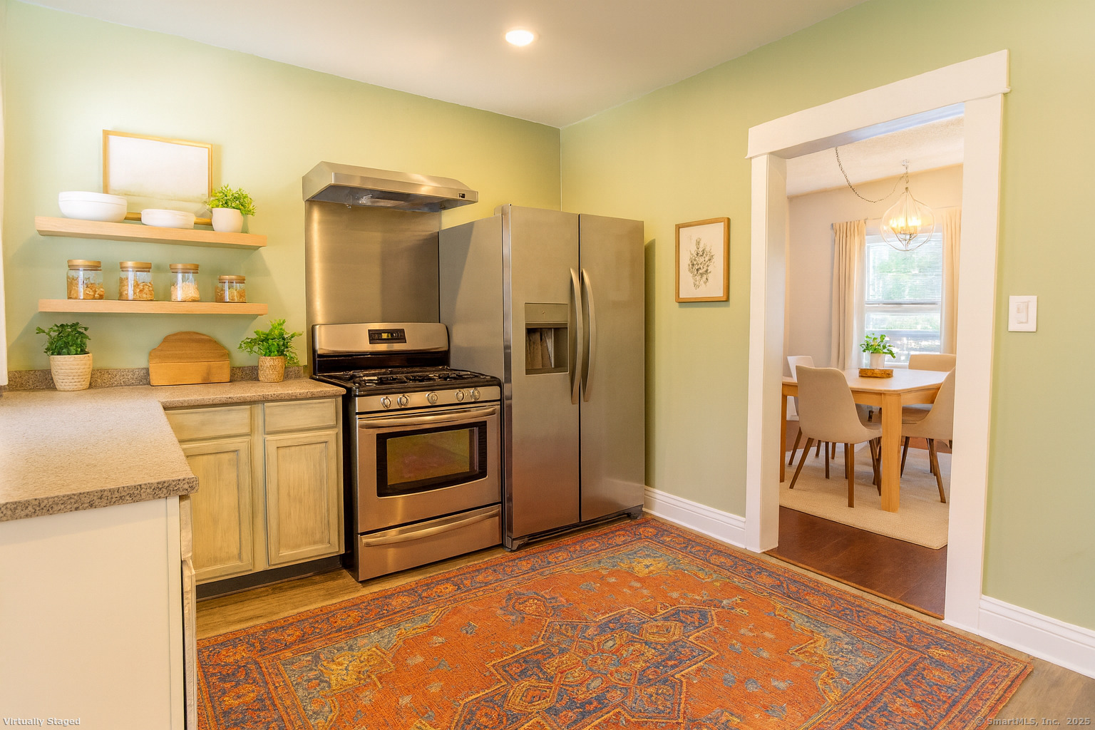 132 Grove Street Putnam, CT 06260 - Photo 21 of 36 a kitchen with stainless steel appliances granite countertop a stove a sink and a refrigerator