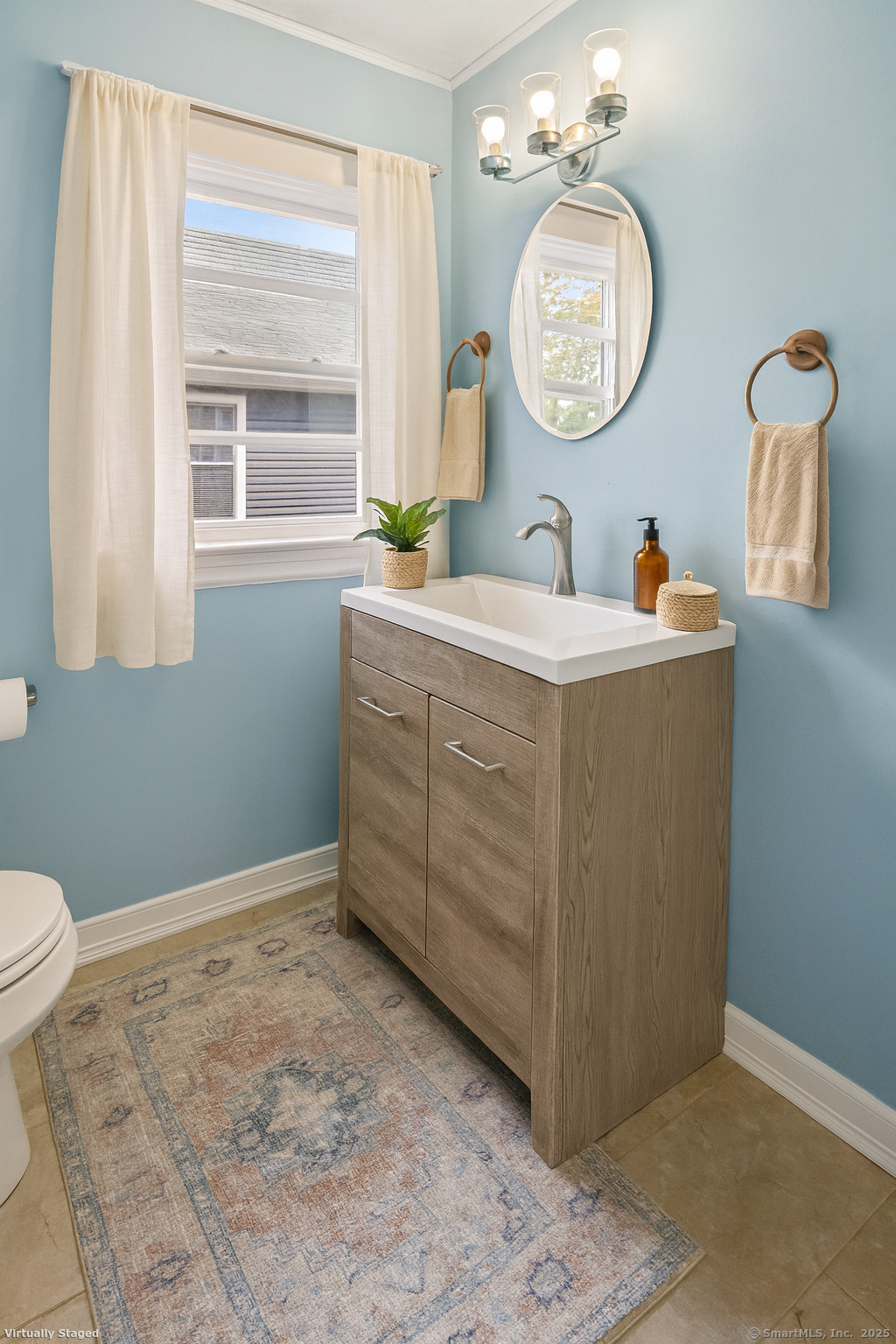132 Grove Street Putnam, CT 06260 - Photo 25 of 36 a bathroom with a toilet a sink and a mirror
