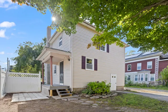 a view of a house with a yard and plants