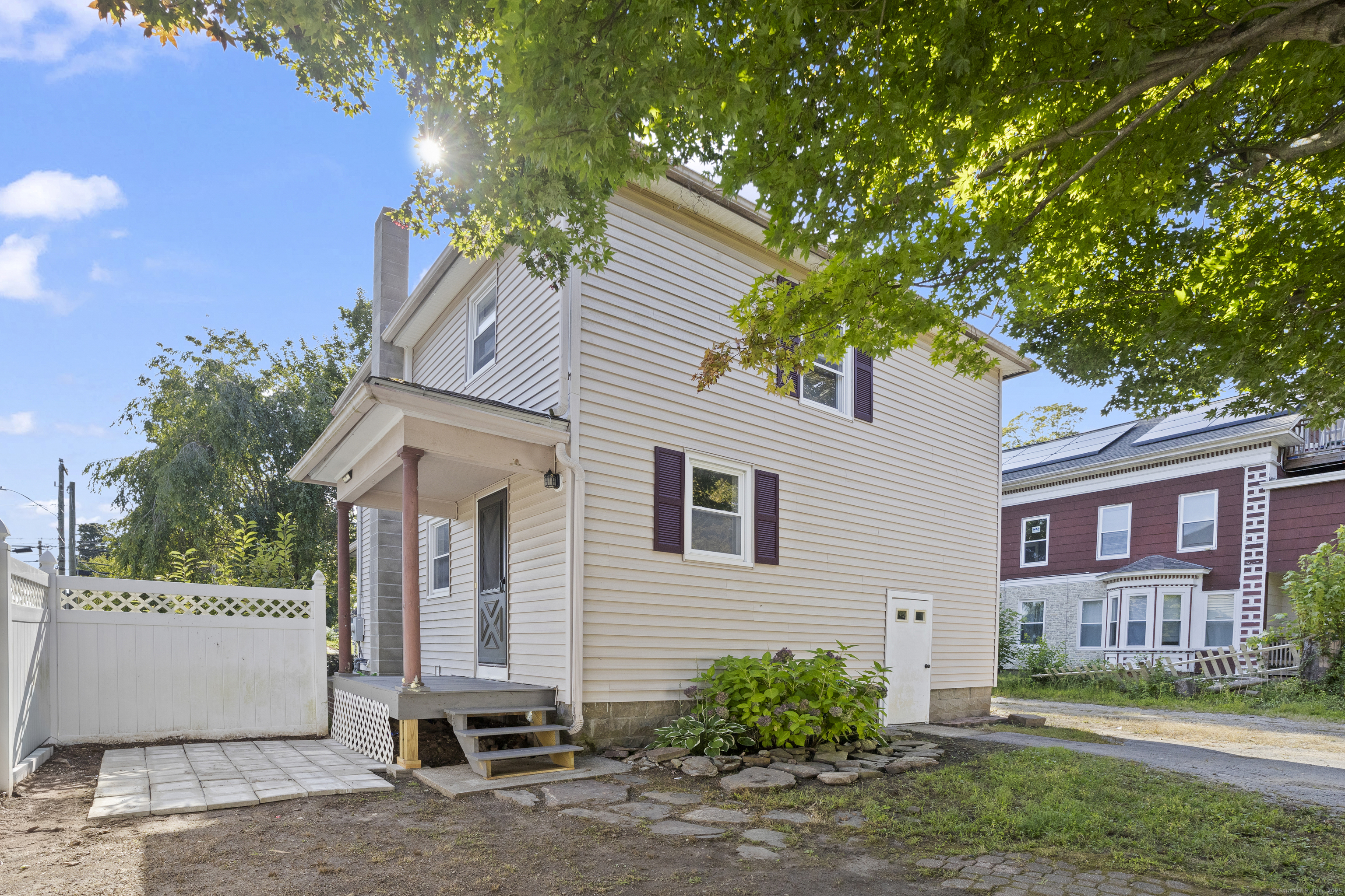 132 Grove Street Putnam, CT 06260 - Photo 3 of 36 a view of a house with a yard and plants